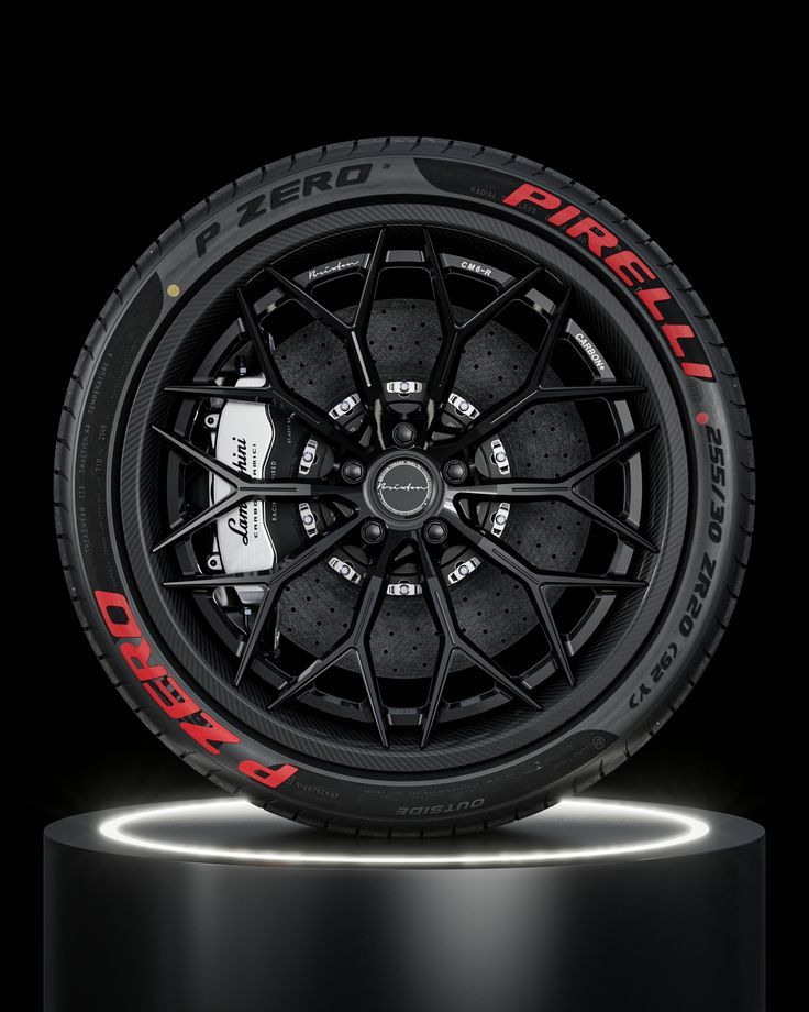 Premium Pirelli P Zero tire with black alloy sports wheel on dark background.